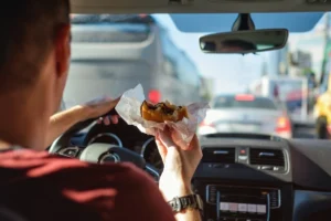 The Legal Risks of Eating or Grooming While Driving in Missouri